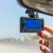 Dash cam mounted on car windshield capturing road footage for accident evidence in St. Augustine, FL