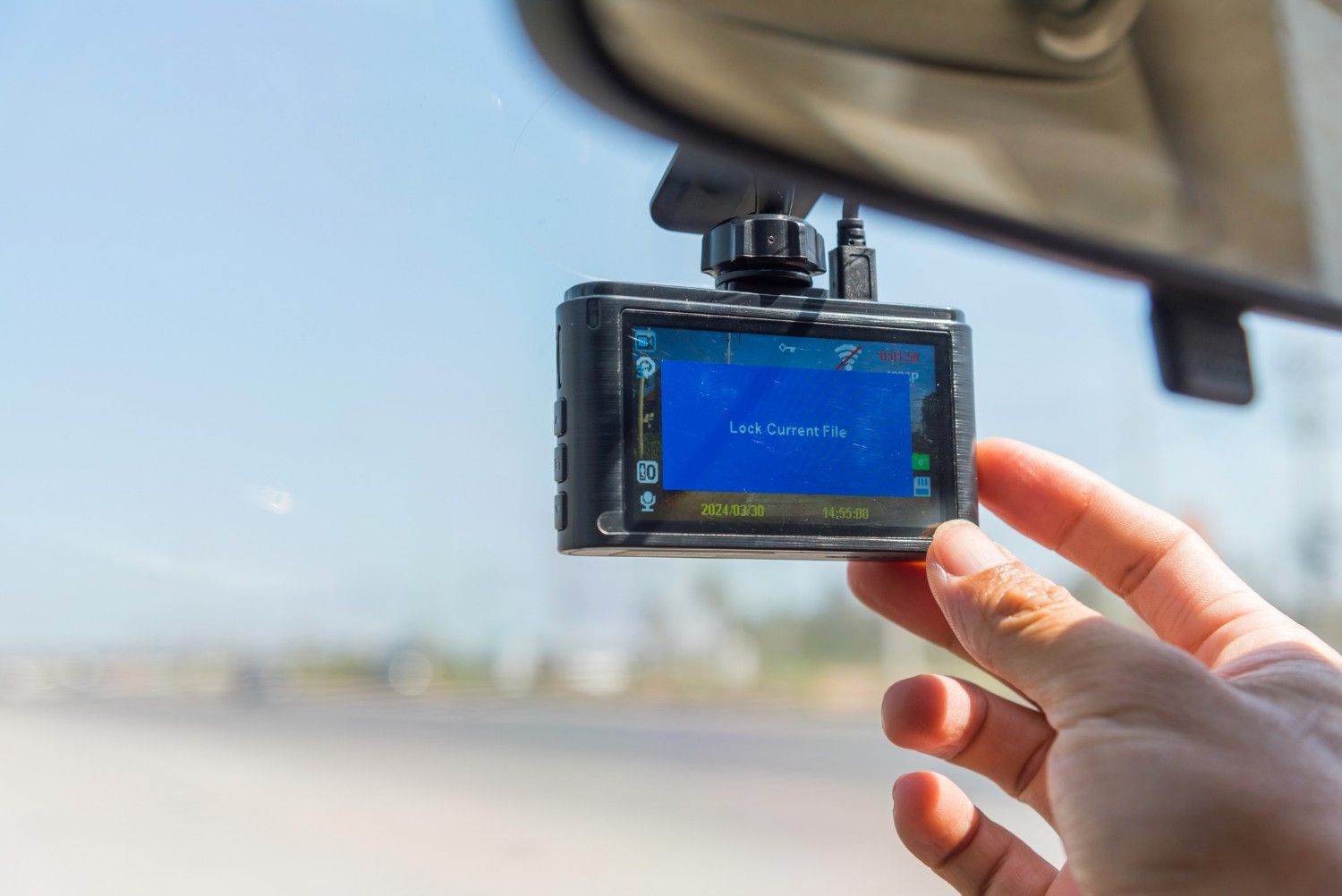 Dash cam mounted on car windshield capturing road footage for accident evidence in St. Augustine, FL